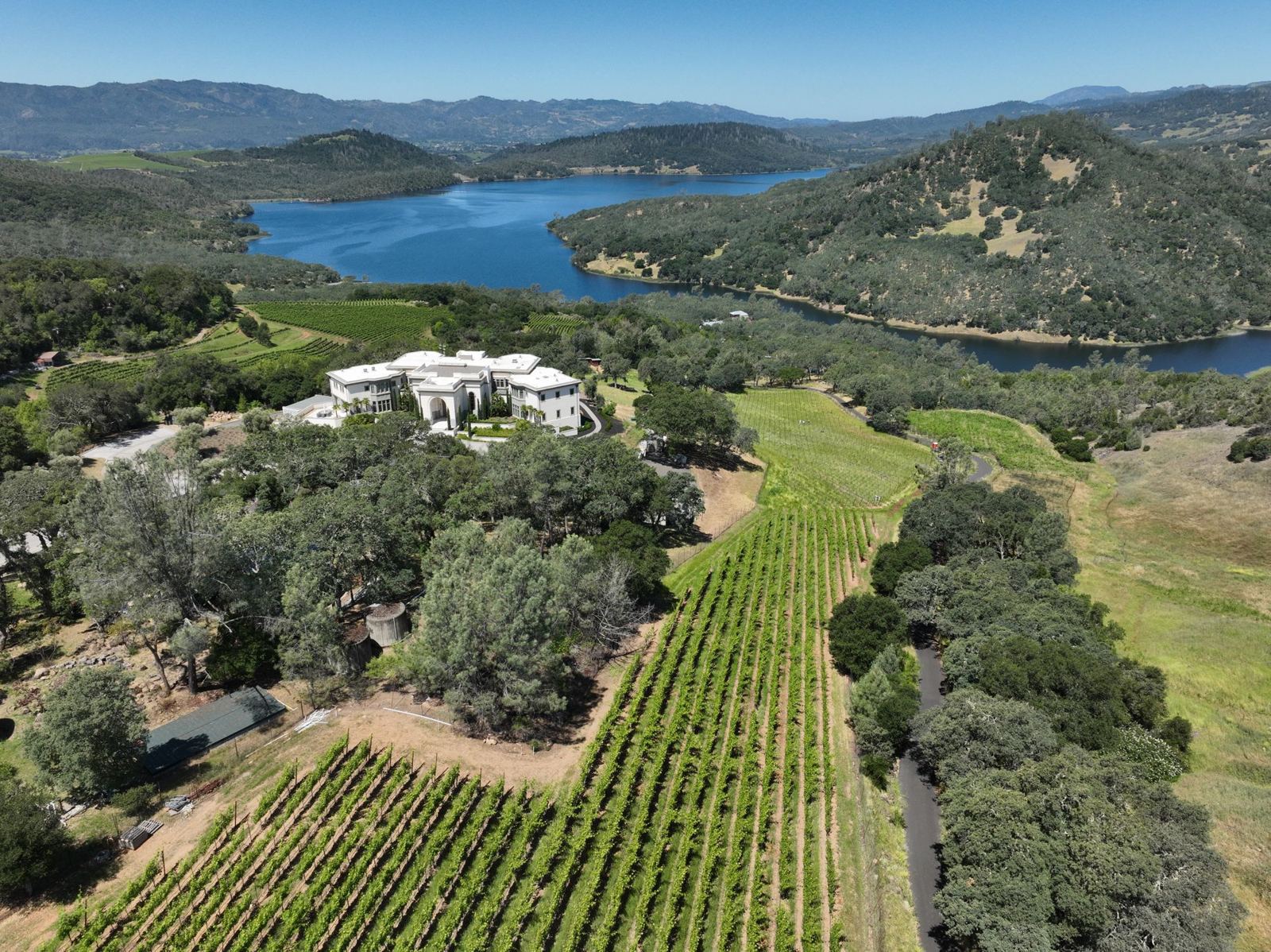 A villa, vineyard and lake from the air in St. Helena